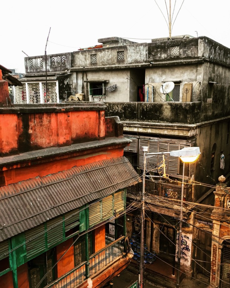 An old street in Calcutta, showing how the buildings weather with the paint blackening due to the heat and humidity